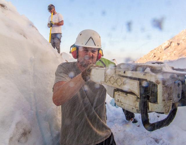 A 'massive effort' as rescue crews use chain saws to recover snowboarder buried by collapsed glacier