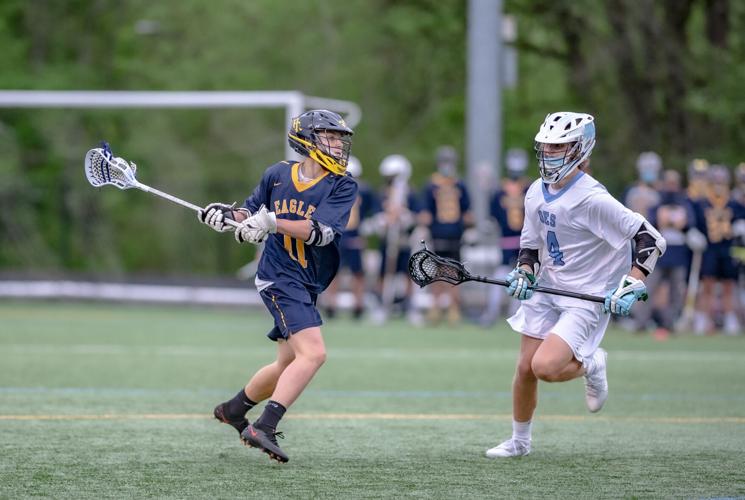 Ryan Salmon shoots past an OES defender to score for the Eagles.jpg