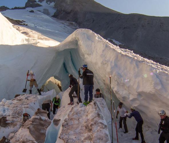 A 'massive effort' as rescue crews use chain saws to recover snowboarder buried by collapsed glacier