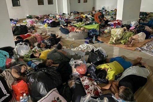 People displaced by flooding resting in a shelter in Nha Trang