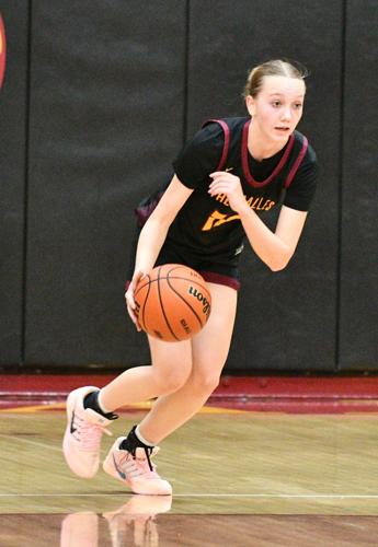 Hailey Johnston (12) pushes the ball up the floor against Molalla earlier this year.