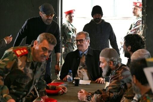 Jordanian director Mohammed Lutfi (top L) instructs actors on set during the filming of the Arabic TV Series 'Al-Khuruj min al-Beir" (Exiting the Well) in Zouk Mikhael, north of Beirut, on February 17, 2026