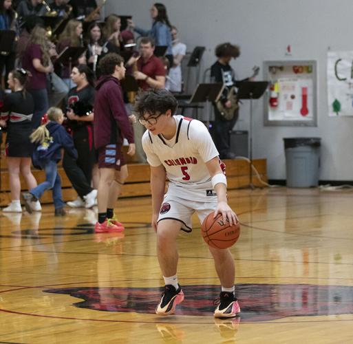 Bruin senior Kevin Melton (5) works on ball handling before a game this winter.