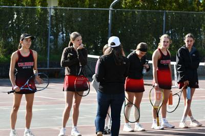 Bruin girls tennis head coach Ashleigh Coyner talks with the team before a match earlier this year.