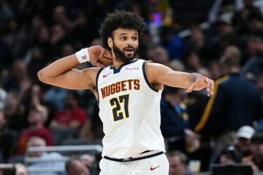 Jamal Murray of the Denver Nuggets celebrates after making a shot in an NBA victory over the Indiana Pacers