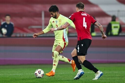 Spain's Ferran Torres (L) put the game to bed 10 minutes before the break by converting a cross from Mikel Oyarzabal