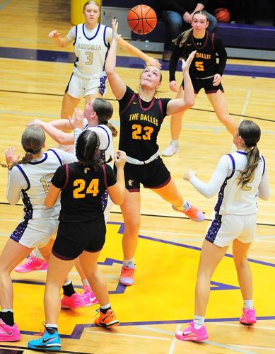 Riverhawk junior, Evelyn Rogers (#23), stretches out and grabs an offensive rebound against the Astoria defense in second half action last Saturday afternoon. Rogers would finish the day with 12 points as the Dalles beat the Lady Fishermen in Astoria, 5...