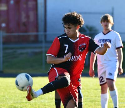 Senior Isaac Reynoso (7) with handles the ball against Stevenson on April 8.