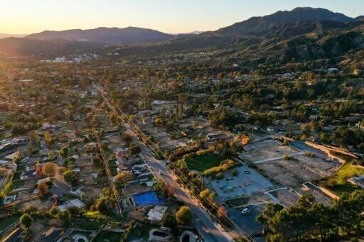 An aerial view of Altadena taken on December 29, 2025, shows the extent of damage and signs of new construction a year after the wildfires
