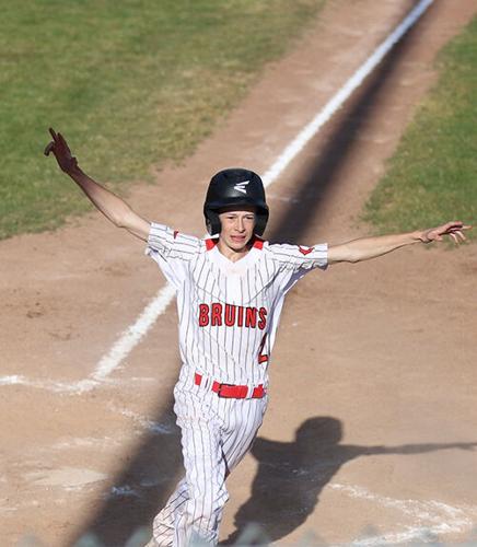 Jaxson Anderson (2) scores a run for the Bruins May 9.