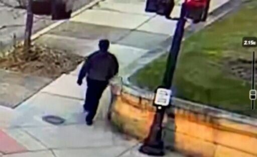 This video grab from CCTV footage released by the Providence Police Department shows the suspect in the Brown University shooting walking along a road near the campus in Providence, Rhode Island