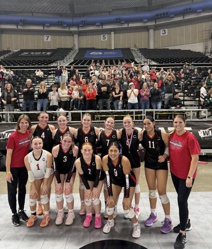 Columbia volleyball players pose in front of their fans at the state tournament   Contributed photo