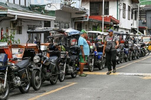 Tricycle taxi drivers in Manila are also struggling with rising fuel costs.