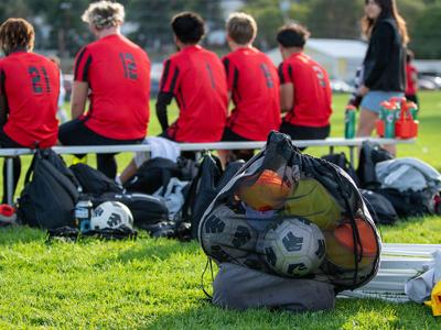 Players from The Dalles boys soccer team watch a match last year.  Noah Noteboom photo