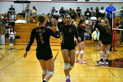 Lola Marti (7) high fives Joella Posini (11) in a match earlier this year