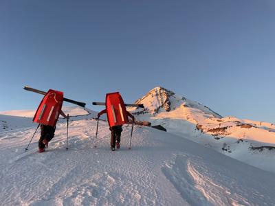 Search volunteers climb Mount Hood