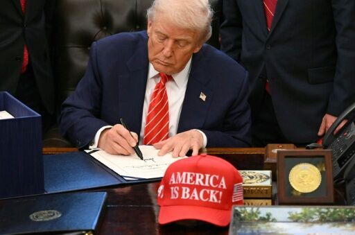 US President Donald Trump signs a funding bill ending a partial government shutdown