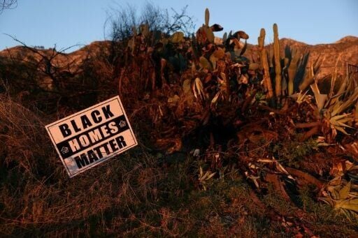 A 'Black Homes Matter' sign, planted on a vacant lot in Altadena