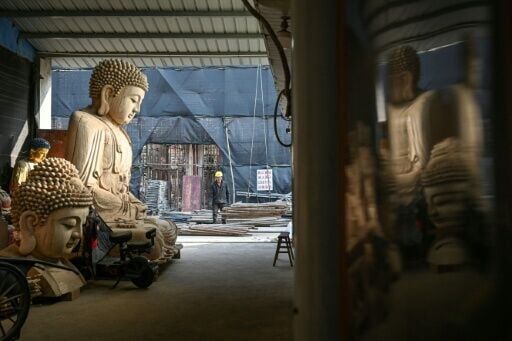 The Buddhist and Taoist sculptures are destined for temples across China