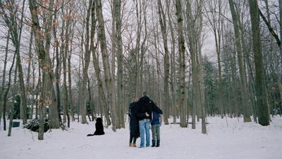 Pung family in a snowy wooded area