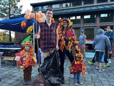The Milam Family dressed up as a pile of leaves being raked up.