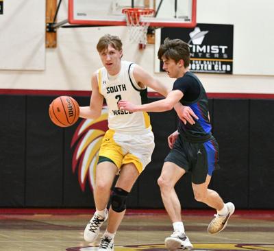 Rowen Huff (2) pushes the ball up the floor this winter.