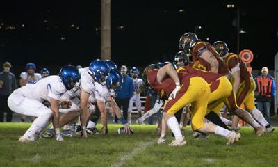 The Dalles defensive gets ready for the snap during a game against La Grande last fall.