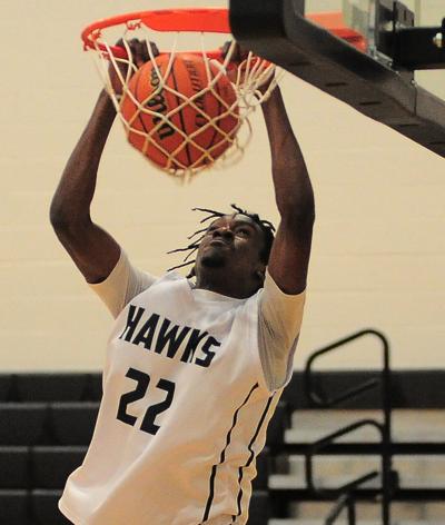 Issac Pitt nails a slam dunk in pre-game  warm-ups  at the Seaside Holiday Tournament in Seaside Or on Thursday December 18th. Rob Hilson photo