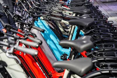 Braunschweig, Germany, March 5, 2023: Victoria e-bikes stand close together in a row at an electric bike fair