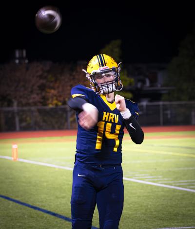 Hood River Valley quarterback Bodie Stuben (14) throws a pass on the sideline against Parkrose on Oct. 30   Zach Thummel photo
