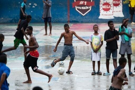 A game of football in the Petion-Ville district of Port-au-Prince, where much of the city is wracked by gang violence