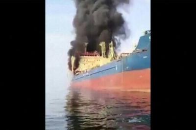 This video grab shows the Palau-flagged oil tanker Skylight, under US sanctions, engulfed in flames after being struck off the coast of Oman during the Middle East War