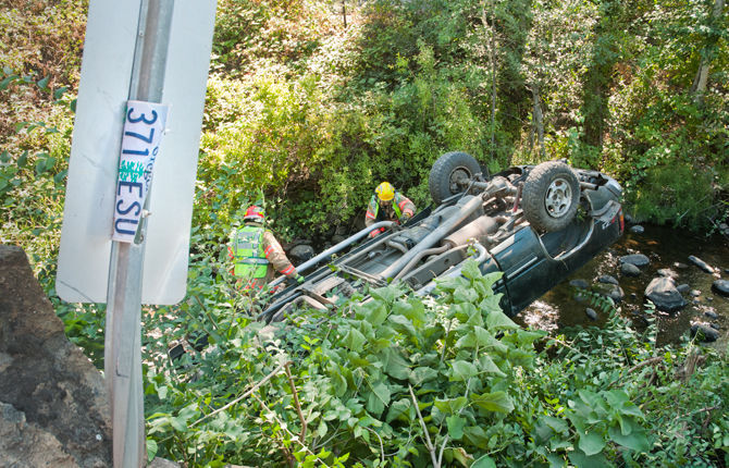 Vehicle crashes into Mill Creek