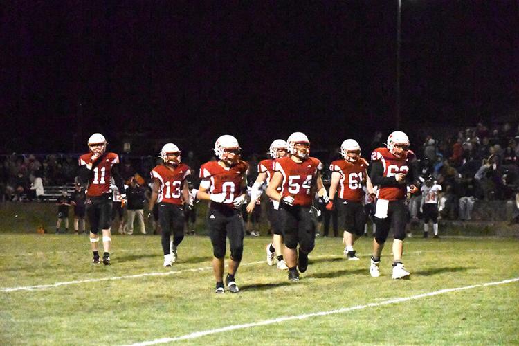 The Dufur football team runs out on to the field vs Imbler Oct. 3