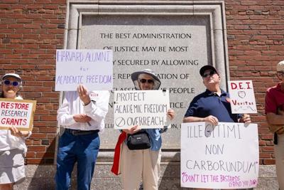 Protesters gather outside a Boston courthouse in July 2025 to rally against the Trump administration's freezing of contracts and grants to Harvard University.