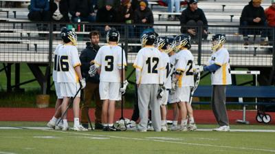 The Eagle boys lacrosse team during a timeout earlier this year