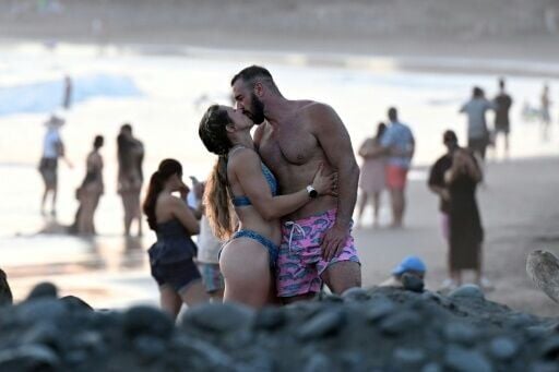 Tourists enjoy El Tunco beach, in La Libertad, El Salvador in February, amid picture-perfect waves and sunsets