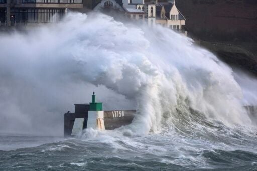 Giant waves crashed over harbour walls across France's far northwest