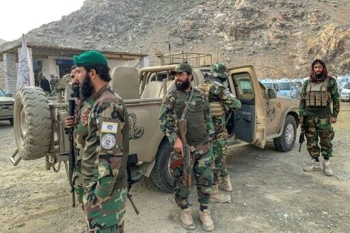 Taliban security personnel stand guard near the Torkham border crossing between Afghanistan and Pakistan in Nangarhar province