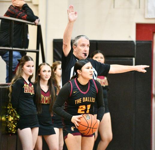 Anuhea Peters (21) inbounds the ball for The Dalles against Molalla earlier this year.