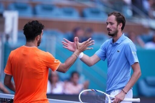 Francisco Cerundolo of Argentina shakes hands with Daniil Medvedev after eliminating the Russian ninth seed from the Miami Open
