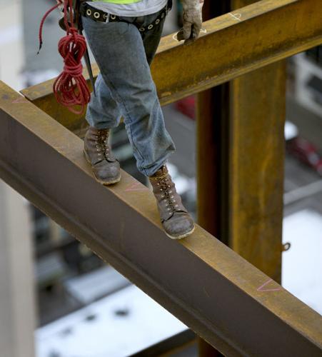 Iron workers brave perils on tower