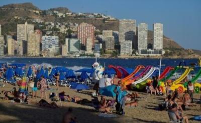 Bathers enjoy the Levante Beach in the popular Spanish resort of Benidorm on September 10, 2025
