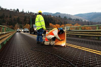Welding crews work on the Hood River-White Salmon Bridge