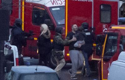 French police kill gunmen in twin attacks, free 16 hostages