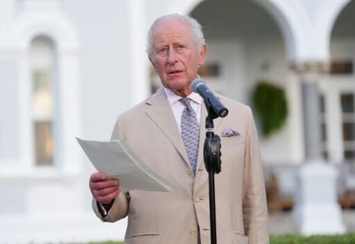 Britain's King Charles III speaks during a garden party at the Government House in Hamilton, Bermuda