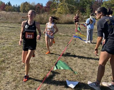Coach Jill Bell encourages senior Alaina Casady
