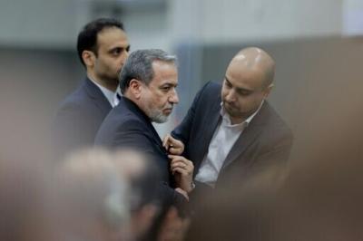 Iran's Foreign Minister Abbas Araghchi (C) has said Tehran is hopeful that talks with the United States would "lead to a sustainable and negotiated solution"