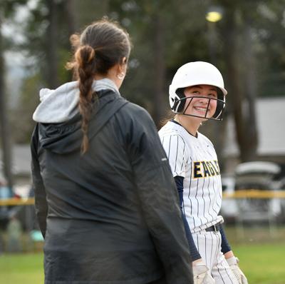 Honey Wampler-Bryan smiles at coach Madelynn Vallejo on third base against Pendleton on March 20.