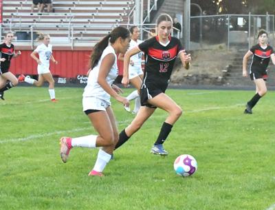 Anya Romero (12) plays defense for Columbia in a match earlier this year